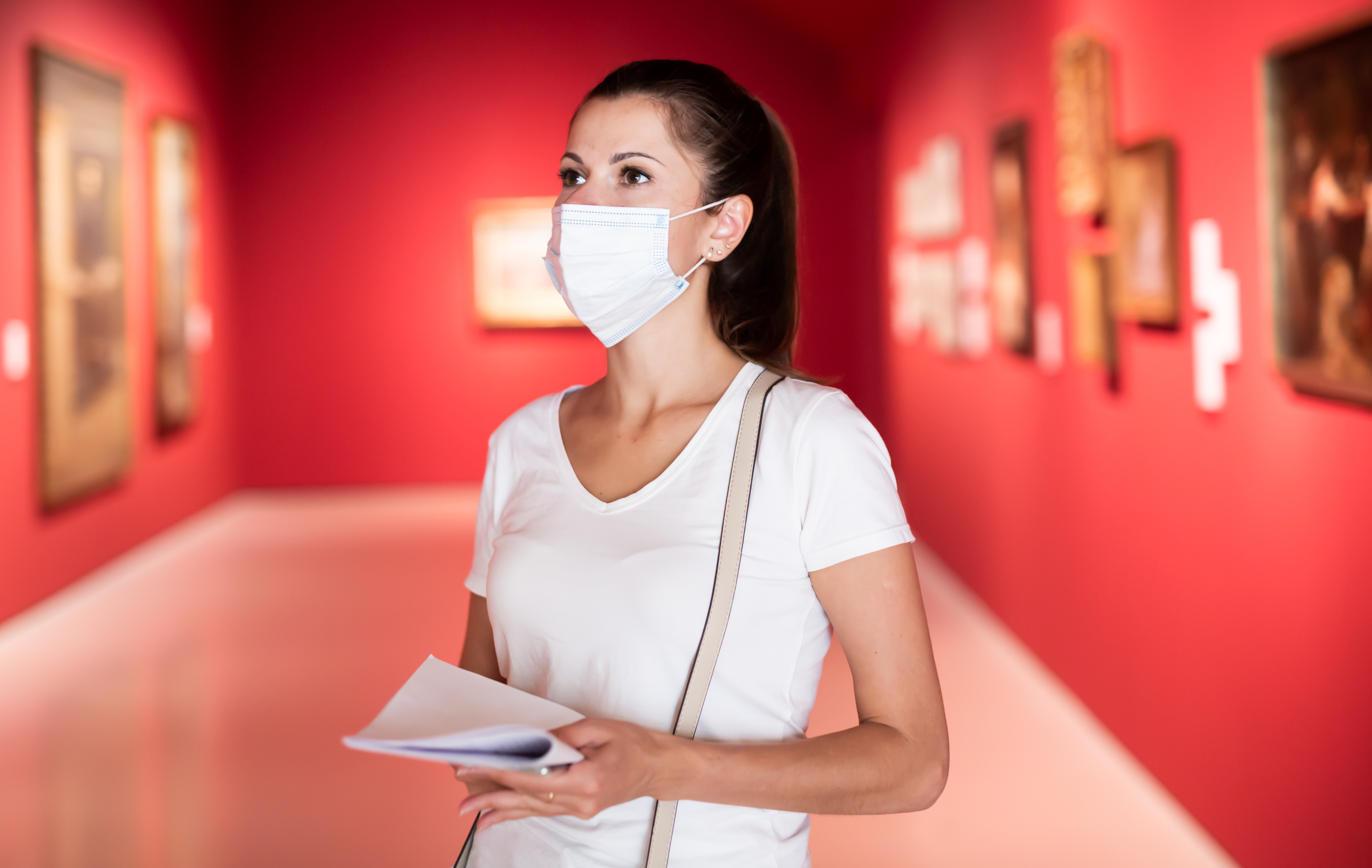 A visitor at a gallery wearing a mask during the pandemic
